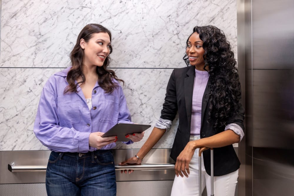 TK Elevator colleagues in an elevator lobby